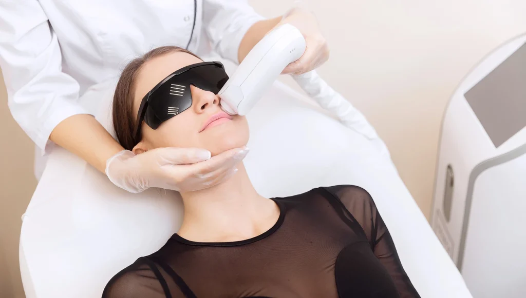 Student receiving facial laser hair removal training at a laser hair removal school l in Downtown.