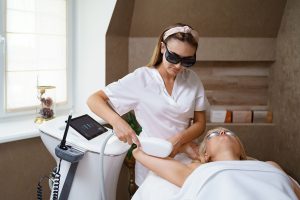 Underarm laser treatment with safety gear at a laser hair removal school San Antonio, showcasing pro clinic technology.