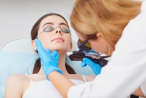 Clinical laser hair removal technician training Woodlands module demonstrating safe facial procedures with protective eyewear.