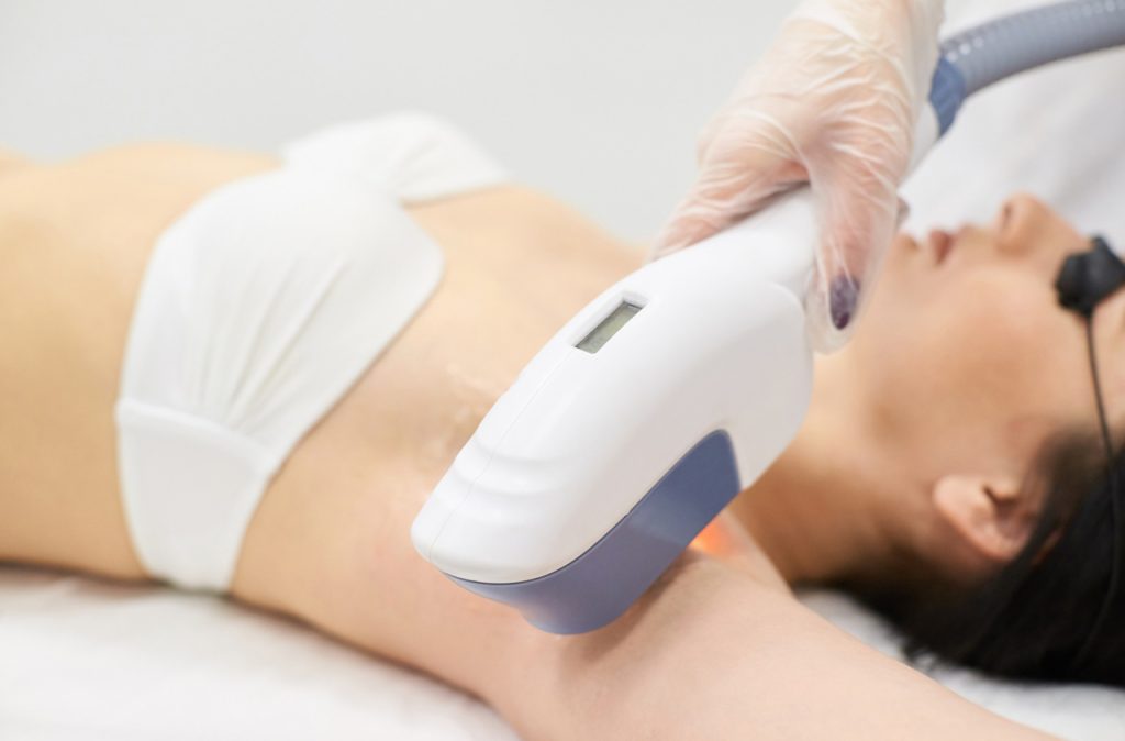 Close up of advanced equipment used for laser hair removal certification woodlands training in a modern medical spa setting.