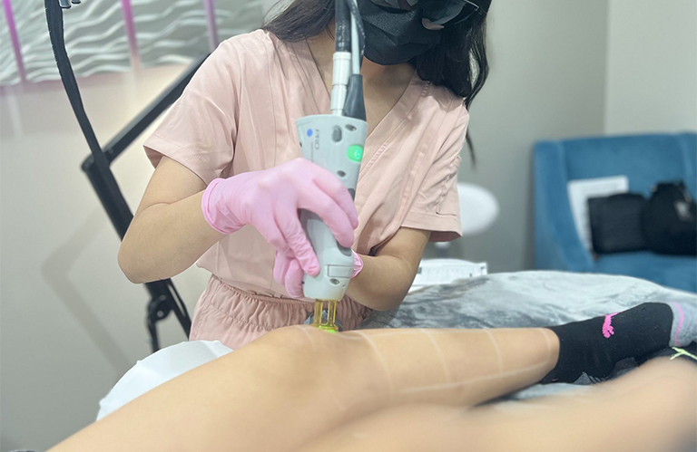 Student practicing clinical skills for a laser hair removal technician certification woodlands professional growth.