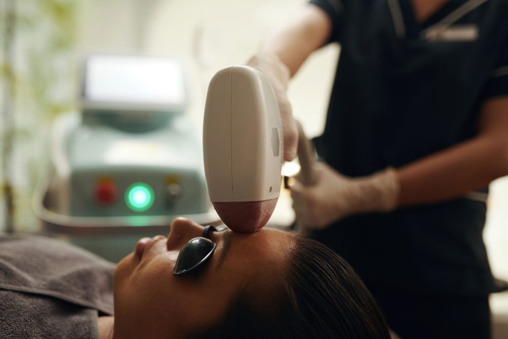 Professional laser hair removal certification Woodlands course teaching a detailed facial laser hair treatment.
