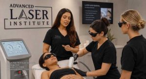 Students getting practical hands-on aesthetic training at an accredited laser hair removal school Woodlands facility.