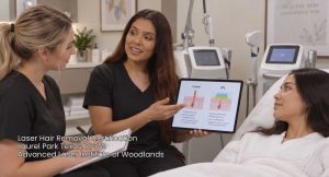 An instructor explaining Laser vs IPL skin treatments to students in a laser hair removal certification class.